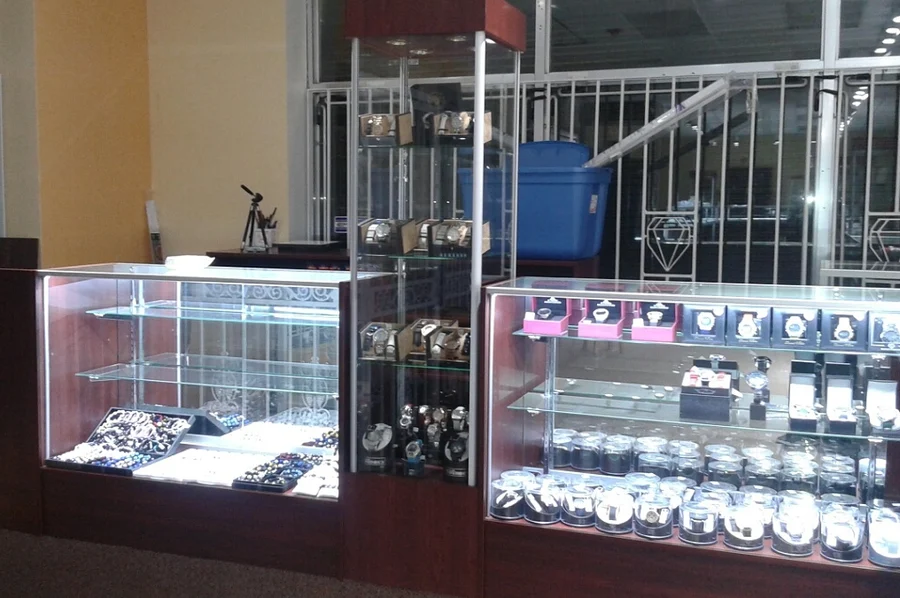 Watch towers and lit glass counters at F & C Golden Gate Jewelers