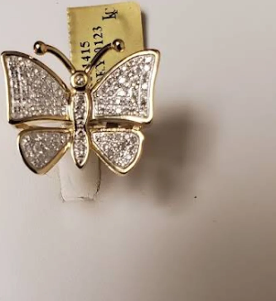 Gold butterfly ring with pavé diamond wings