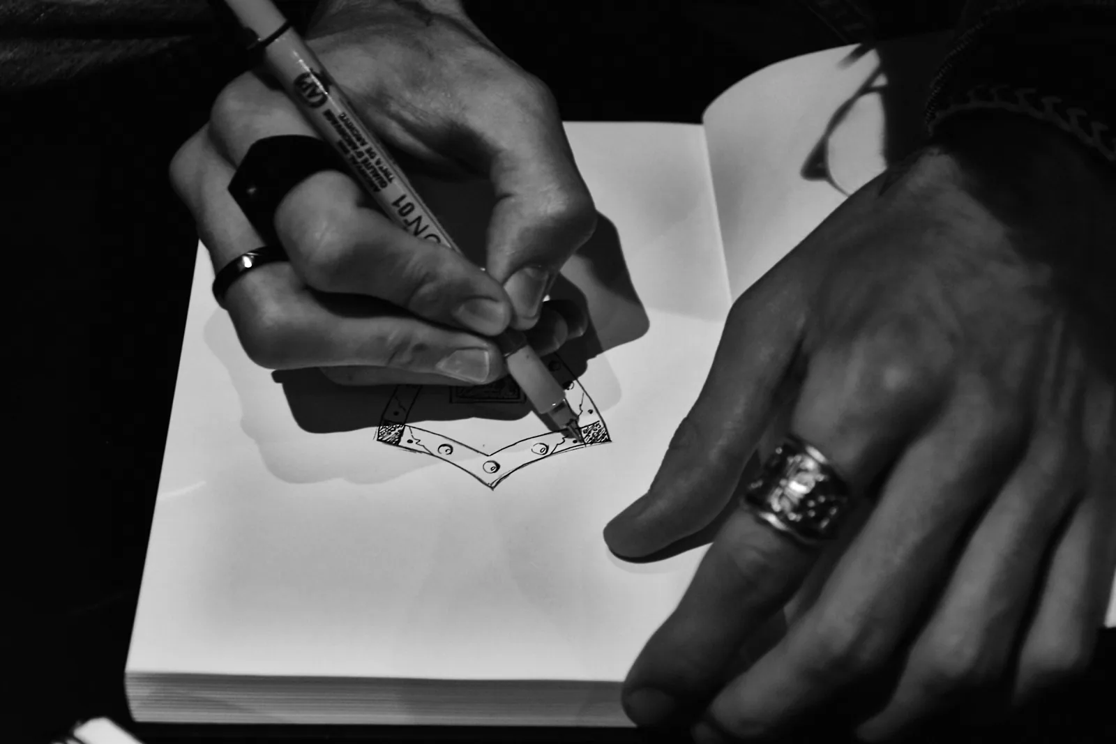 Jeweler sketching an original jewelry design